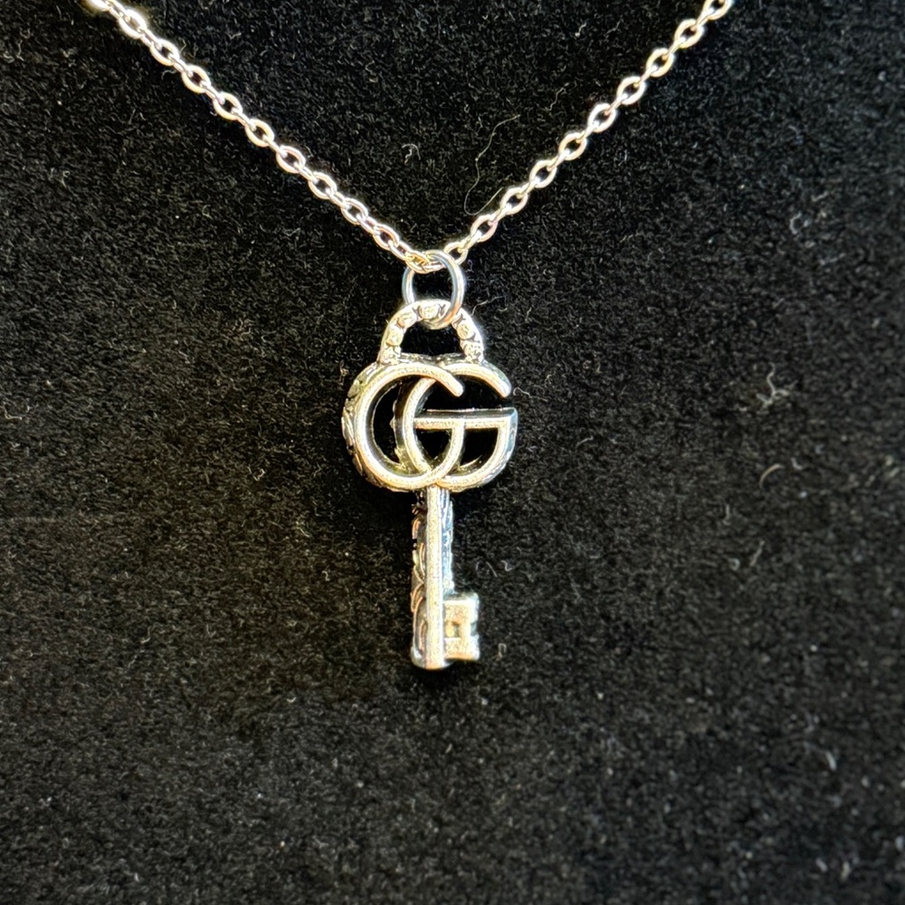 Gucci Silver Key Zipper Pull